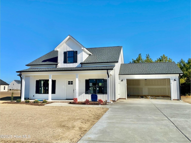 modern farmhouse style home featuring a garage and covered porch