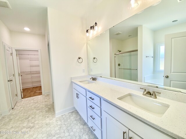 bathroom featuring a shower with door