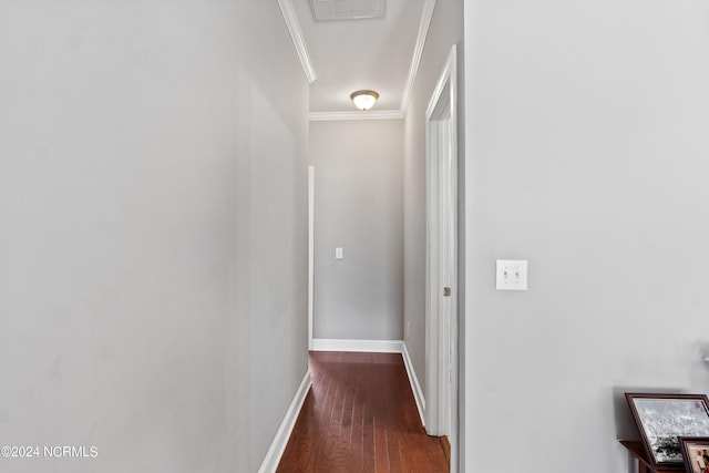 hall featuring crown molding and dark hardwood / wood-style flooring