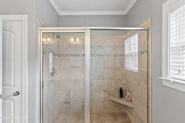 bathroom with crown molding and a shower with door