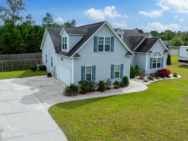 view of front facade with a garage and a front lawn