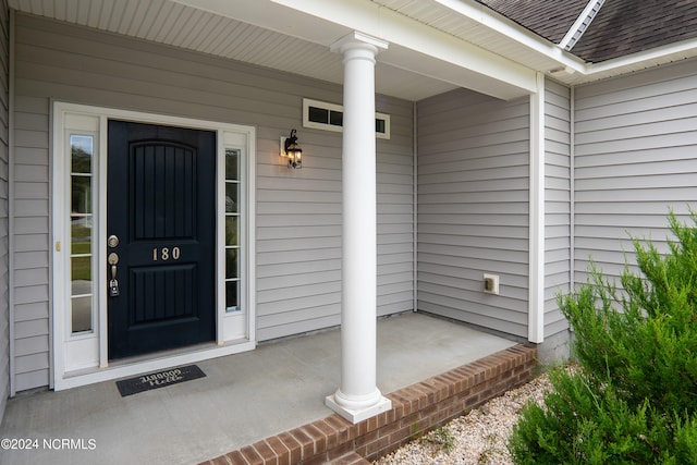 entrance to property with a porch