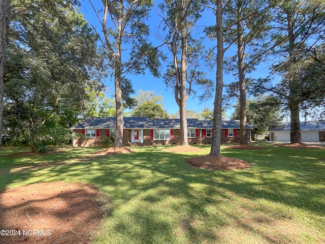 exterior space with french doors and a front lawn