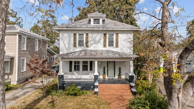 view of property featuring a porch