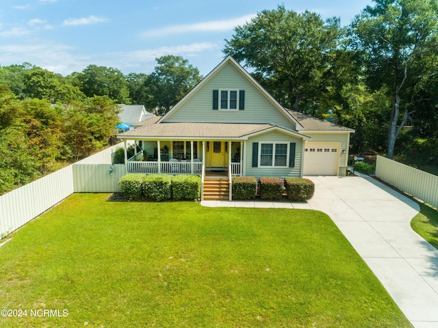 farmhouse-style home featuring covered porch, a front yard, and a garage