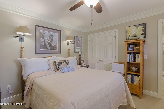 bedroom with a closet, light colored carpet, crown molding, and ceiling fan