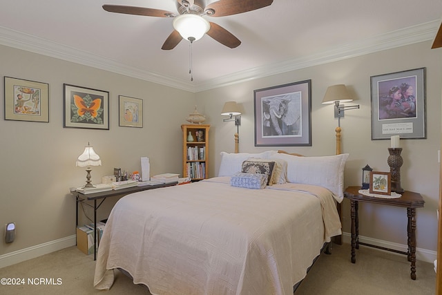 carpeted bedroom with crown molding and ceiling fan