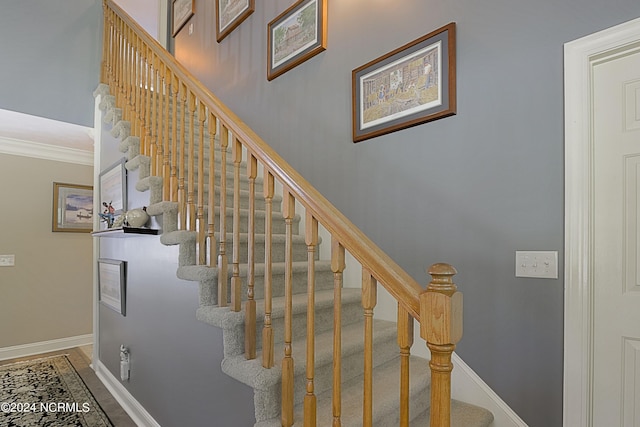 staircase with ornamental molding