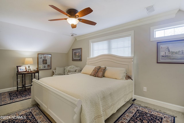 bedroom featuring ceiling fan, carpet floors, lofted ceiling, and crown molding