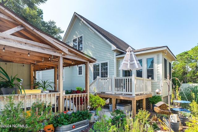 rear view of property with a deck