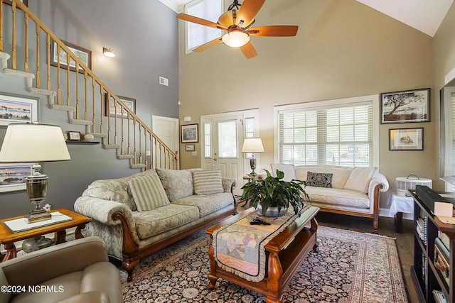 living room with wood-type flooring, high vaulted ceiling, and ceiling fan