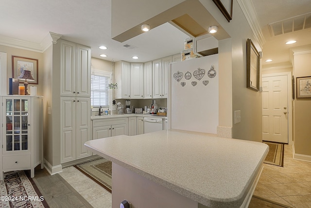 kitchen featuring white cabinets, white dishwasher, light tile patterned floors, kitchen peninsula, and crown molding