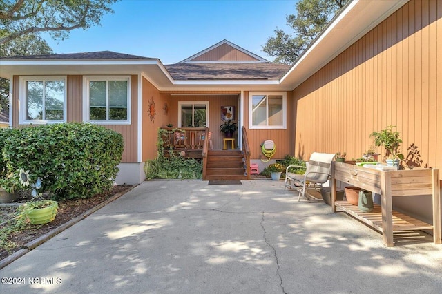 entrance to property featuring a patio area