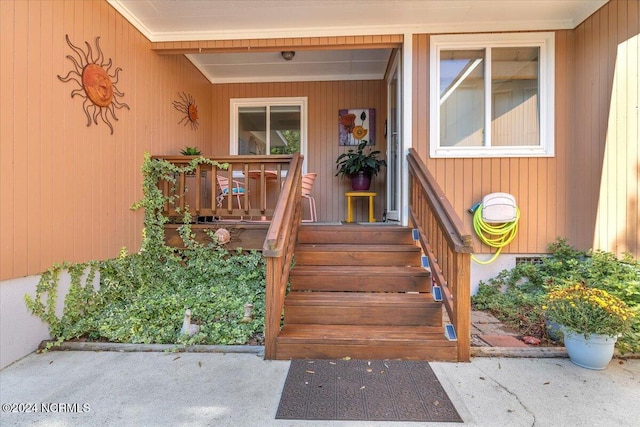 view of exterior entry with covered porch