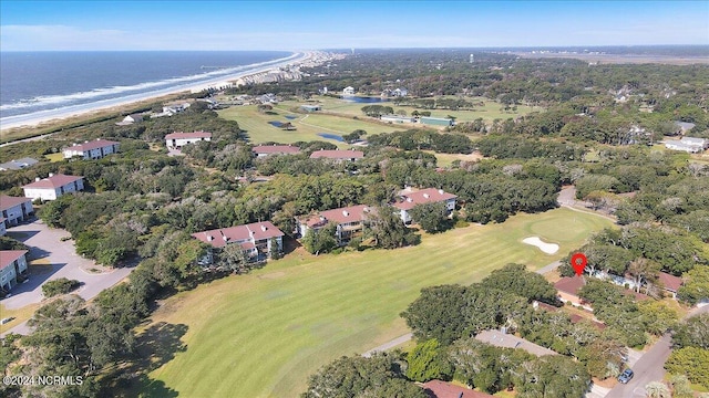 bird's eye view featuring a water view and a beach view