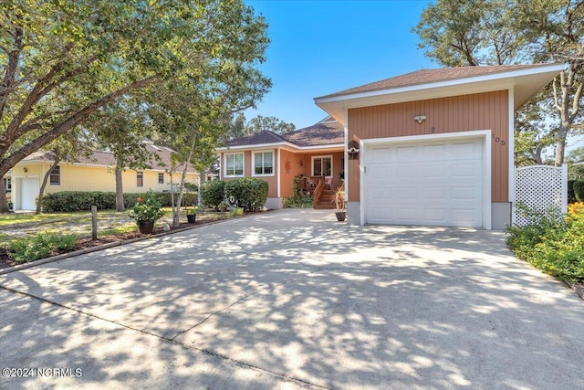 single story home with a garage