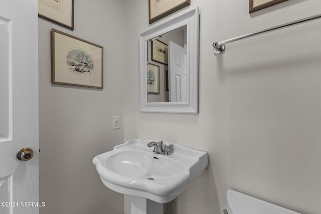 bathroom with sink and toilet