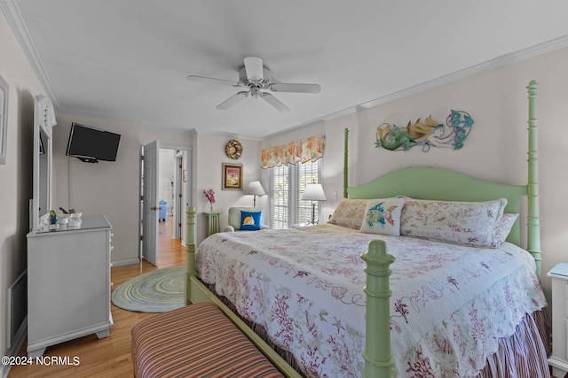 bedroom with ornamental molding, light wood-type flooring, and ceiling fan