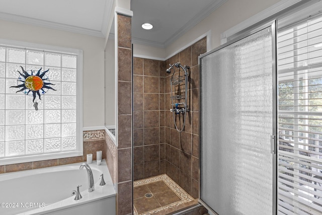 bathroom with shower with separate bathtub, crown molding, and a wealth of natural light