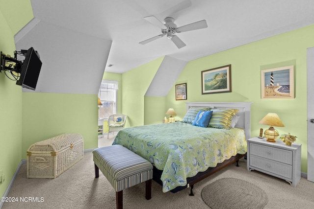 carpeted bedroom with ceiling fan and lofted ceiling