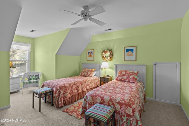 carpeted bedroom featuring vaulted ceiling and ceiling fan