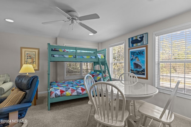 bedroom featuring carpet, multiple windows, and ceiling fan