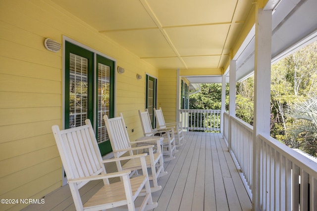 wooden deck featuring covered porch