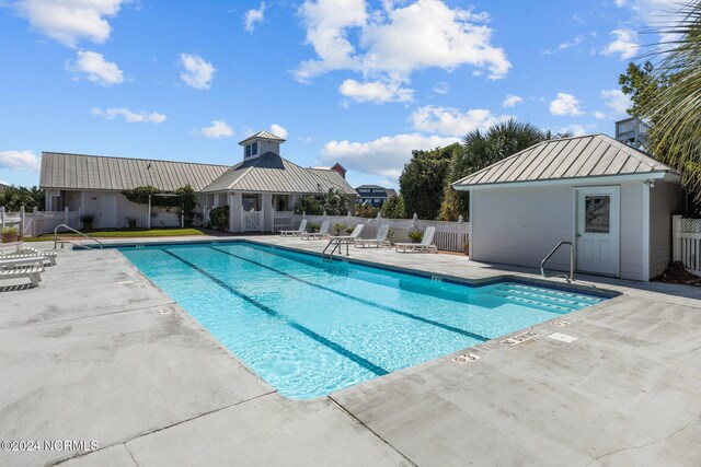 view of swimming pool featuring a patio area