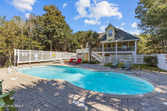 view of swimming pool with a patio area