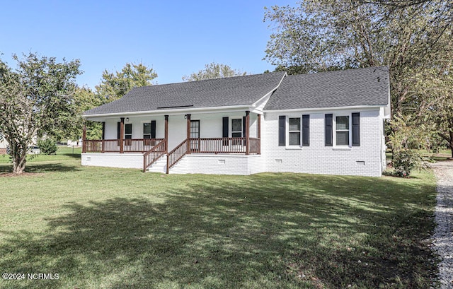 single story home with a wooden deck and a front yard