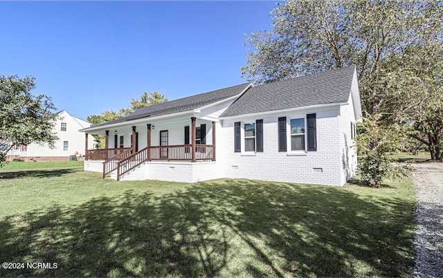 single story home with a front lawn and covered porch