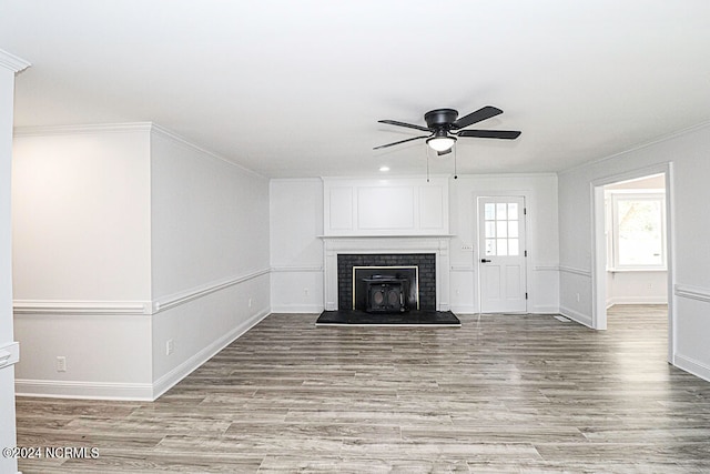 unfurnished living room featuring ceiling fan, light hardwood / wood-style flooring, and crown molding