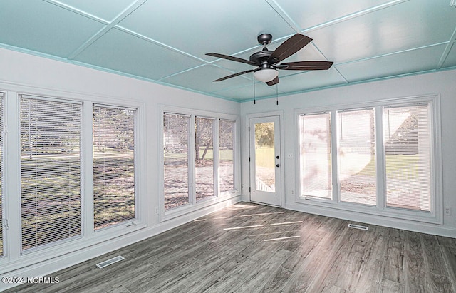 unfurnished sunroom featuring ceiling fan