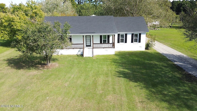 view of front of house featuring a front yard and covered porch