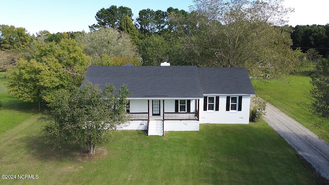 rear view of house with a lawn