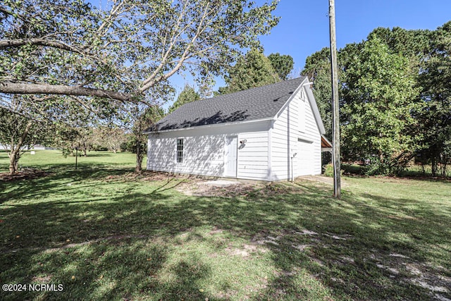 garage with a yard