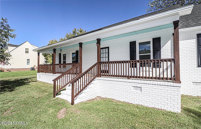 exterior space with a porch and a front lawn