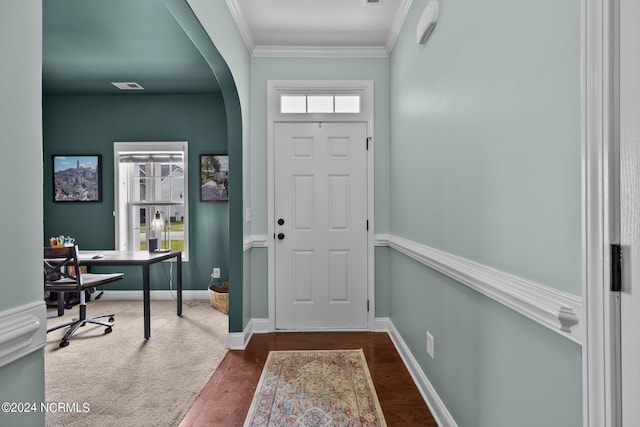 entryway featuring crown molding and dark wood-type flooring