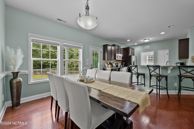 dining area featuring dark hardwood / wood-style floors