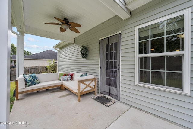 view of patio / terrace with an outdoor living space and ceiling fan