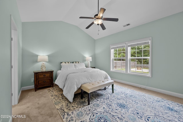 carpeted bedroom with lofted ceiling and ceiling fan