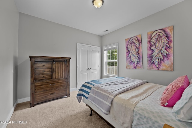 bedroom featuring a closet and carpet