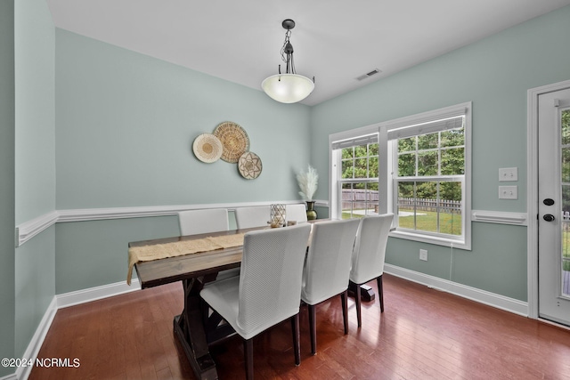 dining space featuring dark hardwood / wood-style flooring