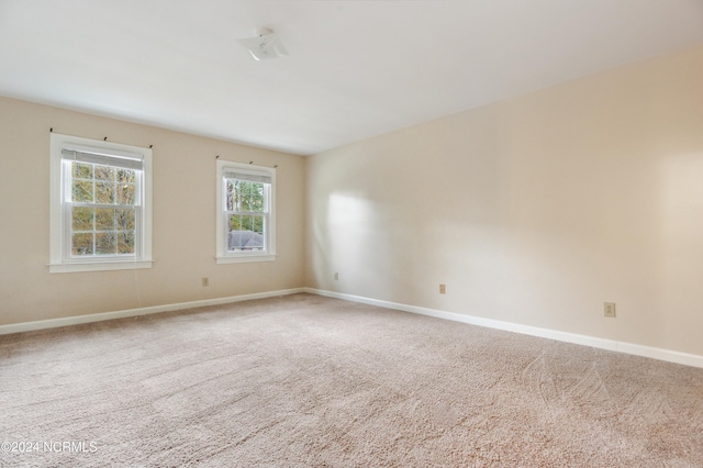 unfurnished room featuring carpet