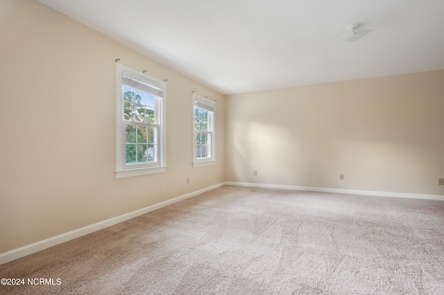 unfurnished room featuring carpet