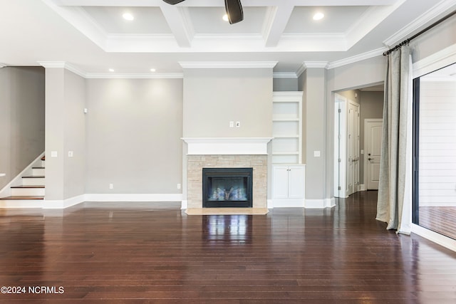 unfurnished living room with a fireplace, dark hardwood / wood-style floors, beamed ceiling, and crown molding