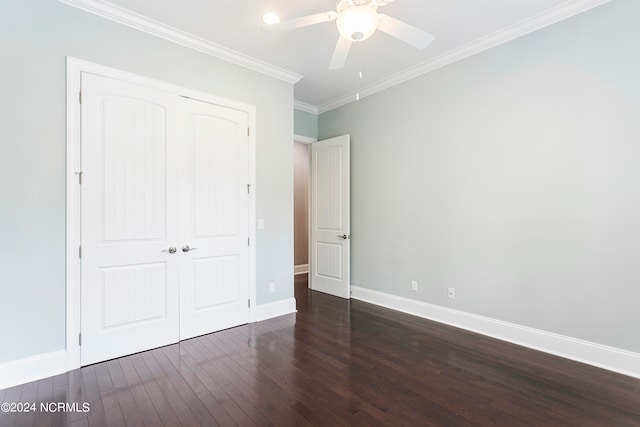 unfurnished bedroom featuring crown molding, ceiling fan, a closet, and dark hardwood / wood-style floors