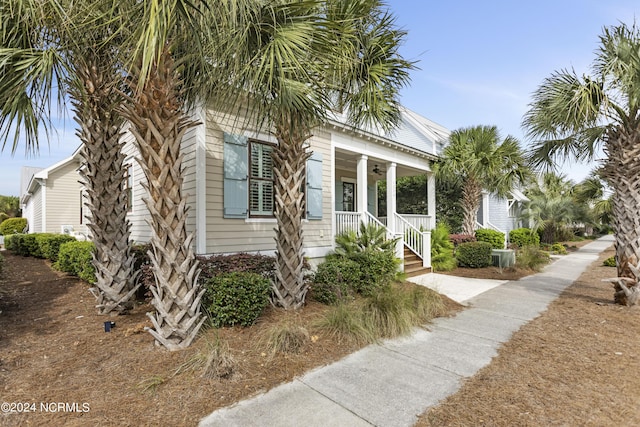 1230 Pinfish Ln, Carolina Beach, NC 28428 - view of property exterior featuring a porch and a ceiling fan