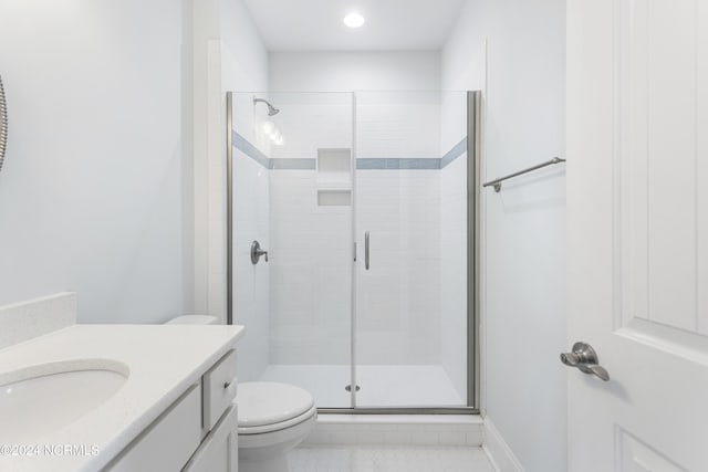 1230 Pinfish Ln, Carolina Beach, NC 28428 - bathroom featuring vanity, a stall shower, tile patterned floors, and recessed lighting