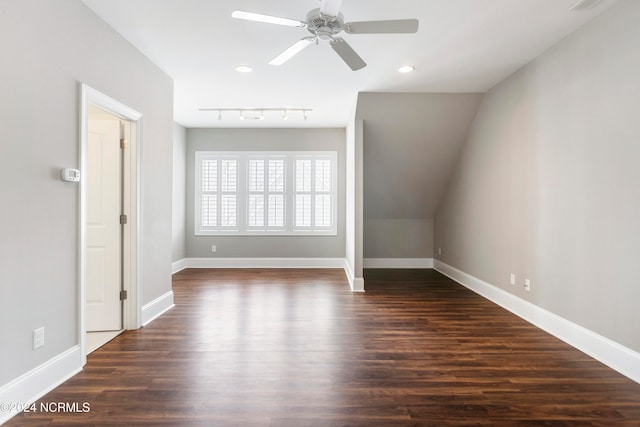 bonus room with ceiling fan, vaulted ceiling, and dark hardwood / wood-style floors